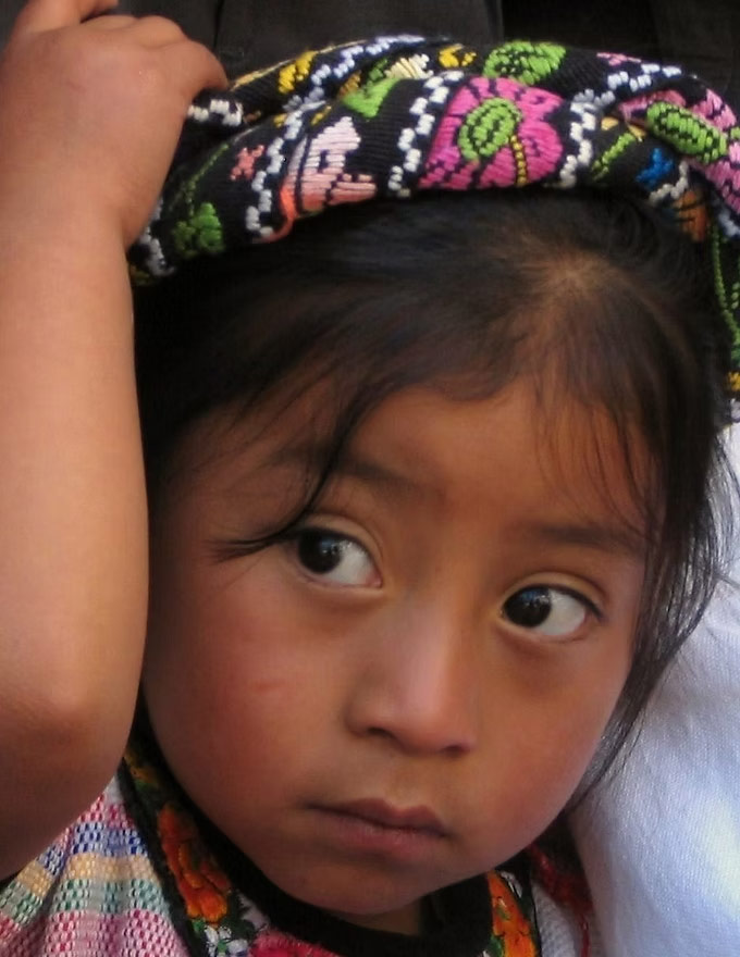 portrait of a young child with a colorful headband