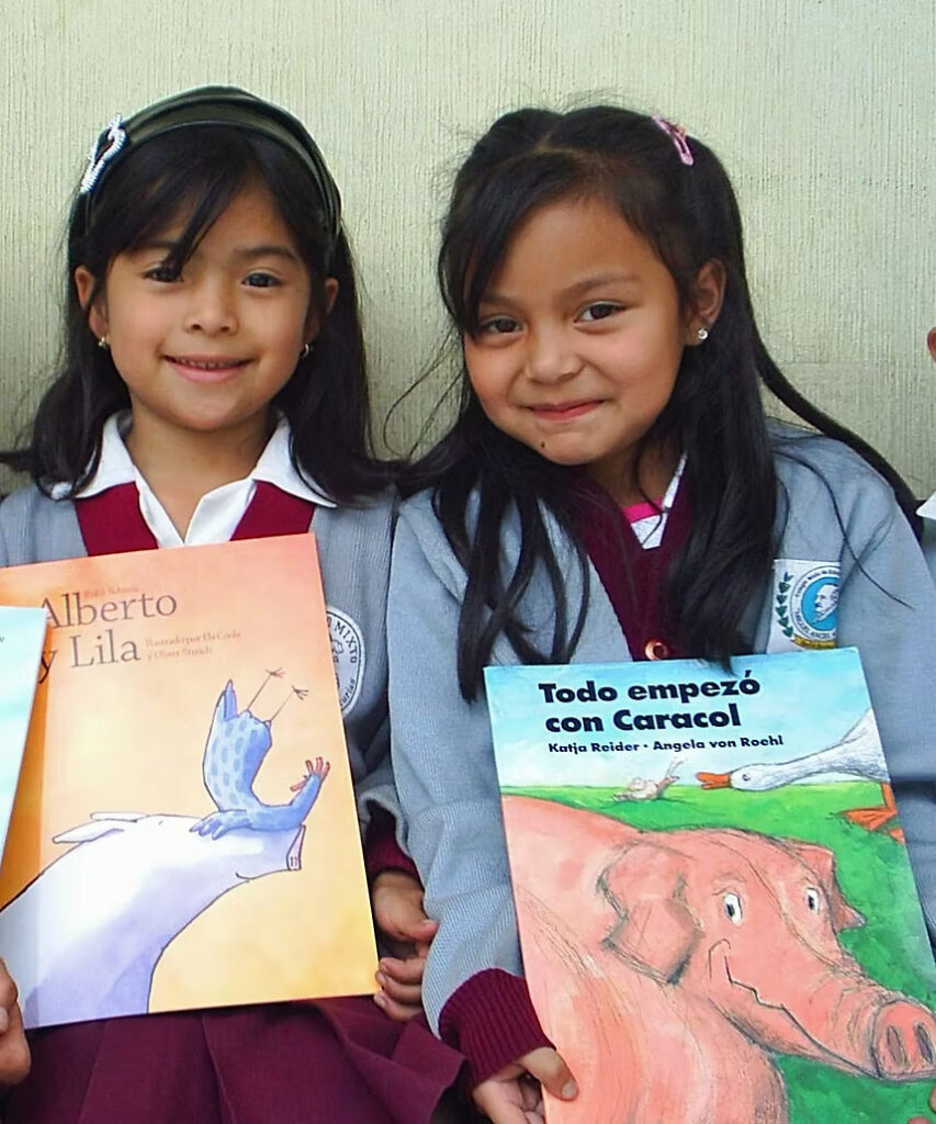 two students photographed with their new books