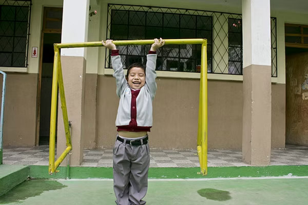 a young child playing on a playground